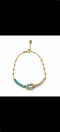 Pulsera de nudo con piedras azules y detalles tricolor 10K